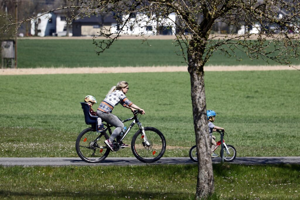 A family riding bicycles in the park